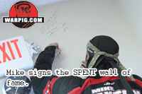 Mike Paxson of Ironmen signs the SPENT wall of fame.